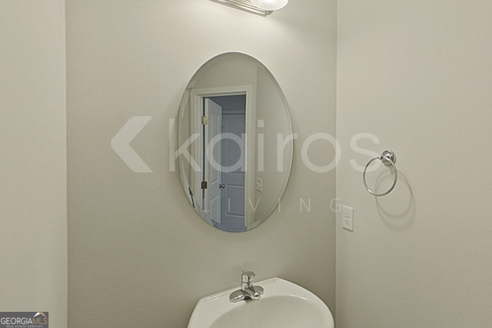 103 Western Red Cedar Drive Springfield, GA 31329 - Photo 19 of 24 a bathroom with a sink and mirror