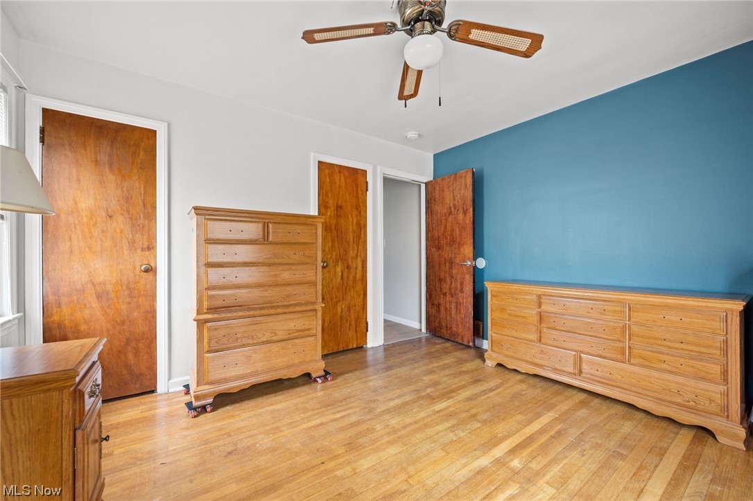 6454 Crossview Road Independence, OH 44131 - Photo 11 of 27 First floor bedroom featuring light hardwood, fresh paint, 2 closets, and ceiling fan