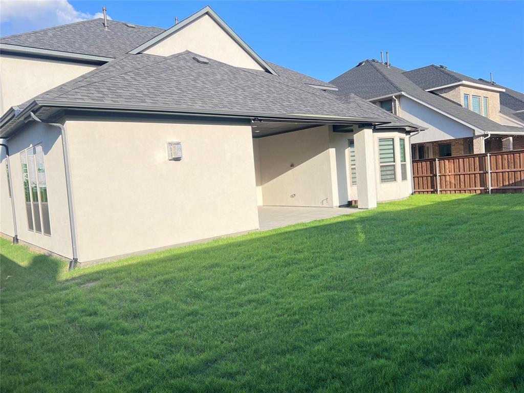 6825 Entwistle Road Frisco, TX 75034 - Photo 29 of 33 a front view of a house with a yard
