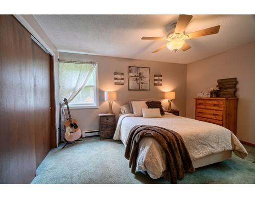 169 Farnsworth Road Templeton, MA 01468 - Photo 19 of 30 a bedroom with a bed and a chandelier
