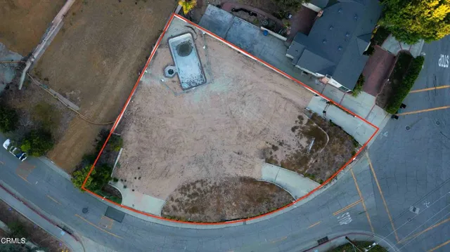 an aerial view of a house with a garden