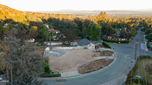 a backyard of a house with large trees