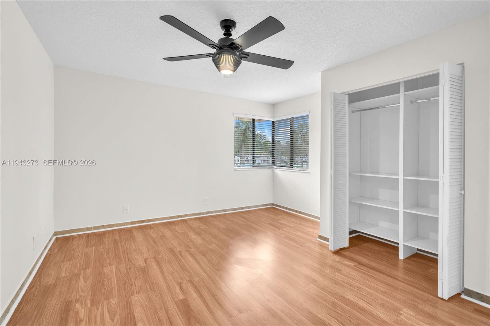 1618 Northwest 81st Way, Unit 1618 Plantation, FL 33322 - Photo 32 of 38 wooden floor in an empty room with a window