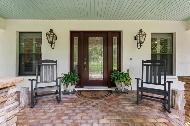 a bedroom with furniture and a wooden floor