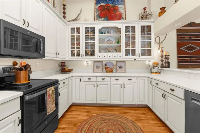 a view of a livingroom with furniture and a flat screen tv