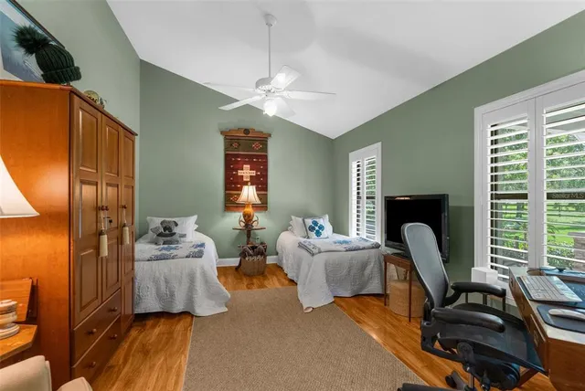 a view of house with backyard and outdoor seating