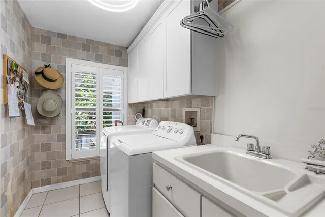 a backyard of a house with a yard and outdoor seating