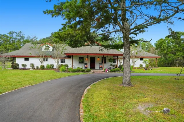 a view of a yard with an outdoor space