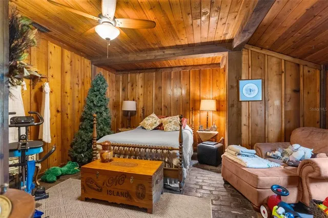 a view of a field with a tree in the background