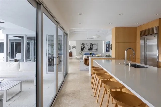 a view of a dining room with furniture wooden floor and chandelier