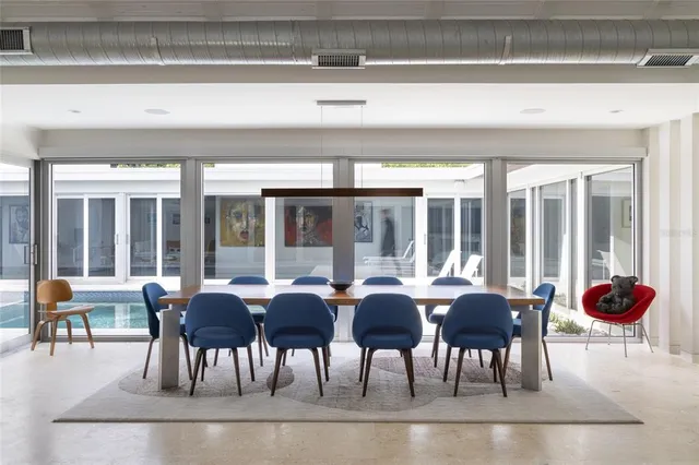 a bedroom with a white bed and white walls