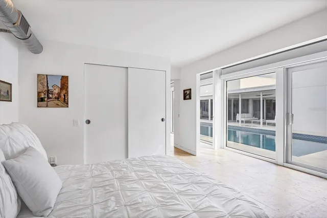 a view of living room with a lot of large windows