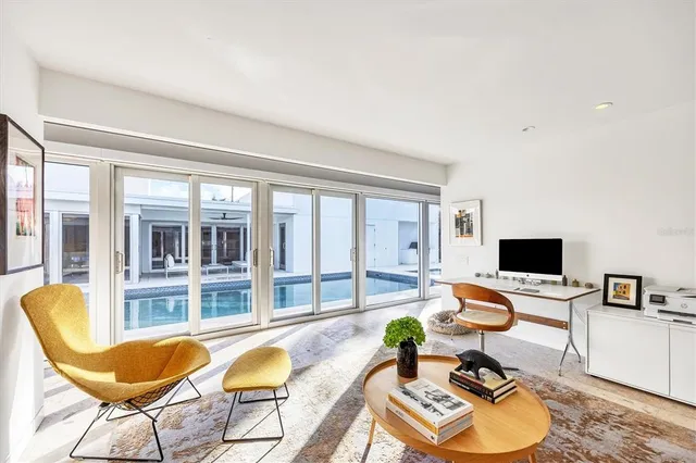 a view of a patio with table and chairs and potted plants