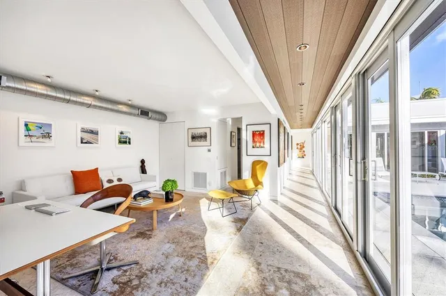 a view of a patio with couches and potted plants