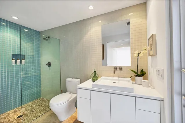 a view of a chair and table in front of a house