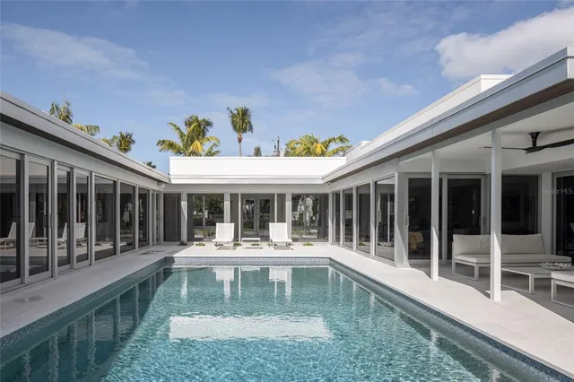 a kitchen with sink and cabinets