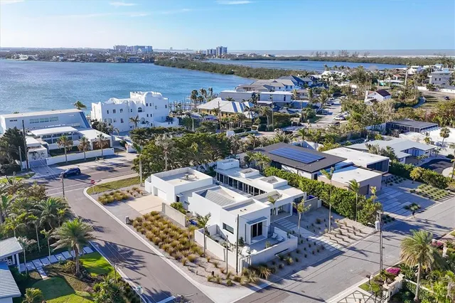 an aerial view of a house with a lake view