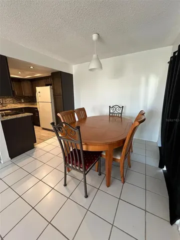 a large kitchen with stainless steel appliances granite countertop a stove and a sink