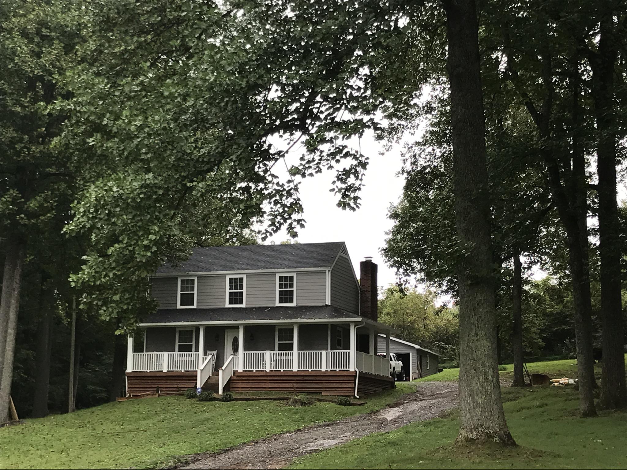 8174 New Chapel Road Springfield, TN 37172 - Photo 2 of 14 a front view of a house with a garden