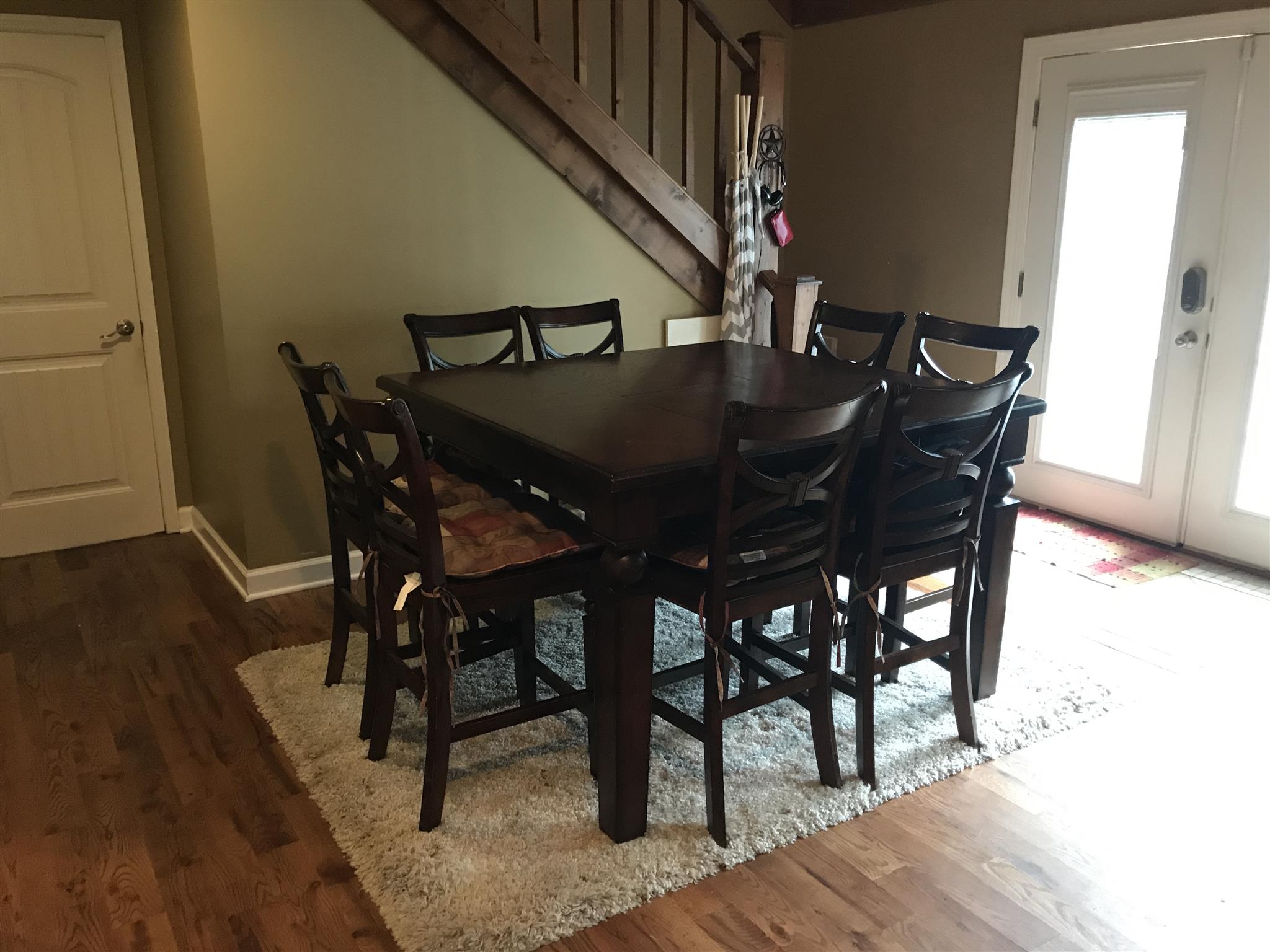 8174 New Chapel Road Springfield, TN 37172 - Photo 12 of 14 a view of a dining room with furniture and wooden floor