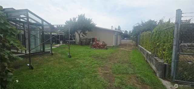 a backyard of a house with lots of green space