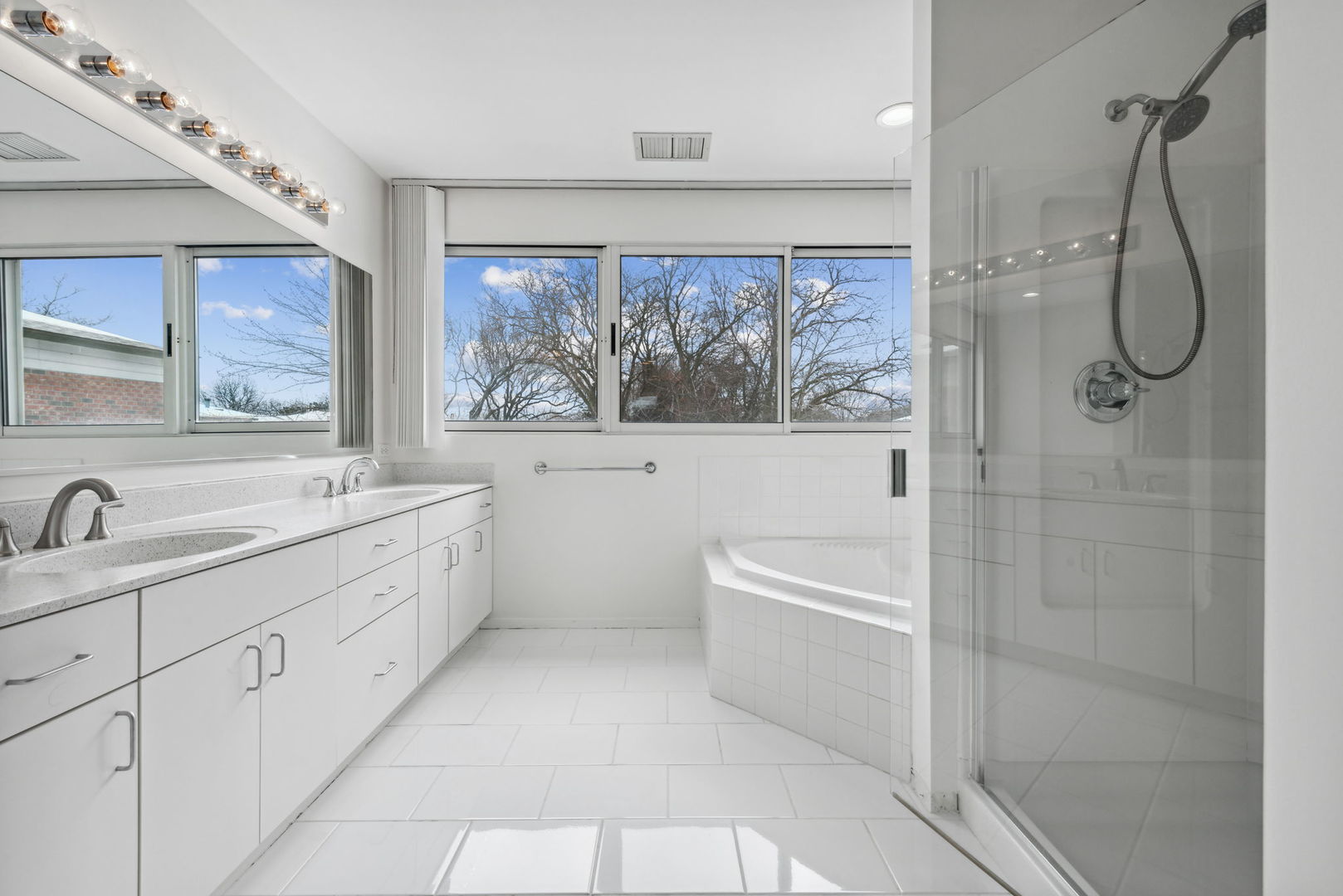 357 Milford Road Deerfield, IL 60015 - Photo 16 of 31 a bathroom with a granite countertop sink a toilet and shower