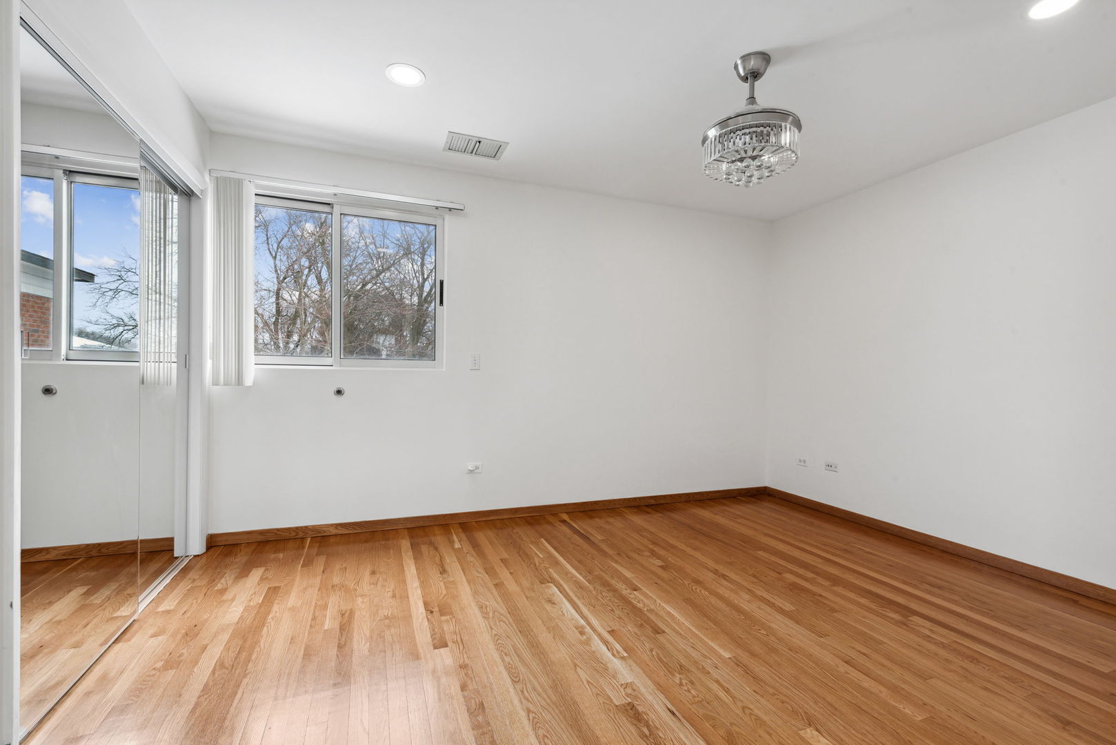 357 Milford Road Deerfield, IL 60015 - Photo 20 of 31 a view of an empty room with wooden floor and a window