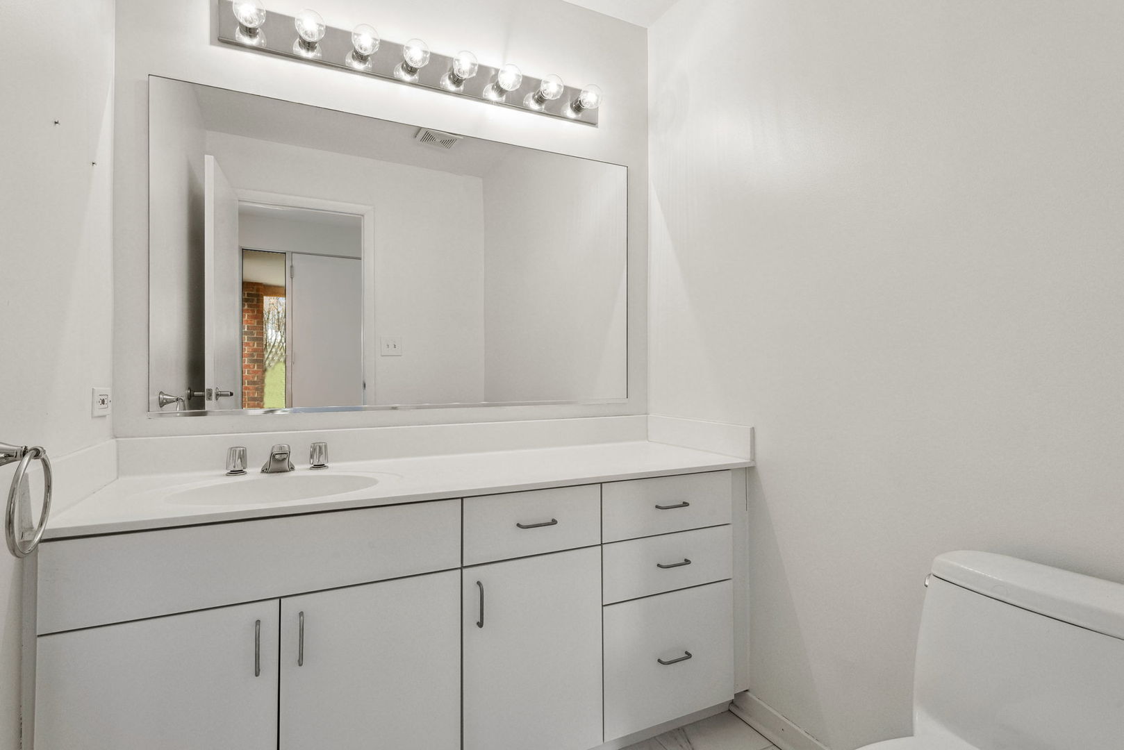 357 Milford Road Deerfield, IL 60015 - Photo 23 of 31 a bathroom with a sink and a mirror