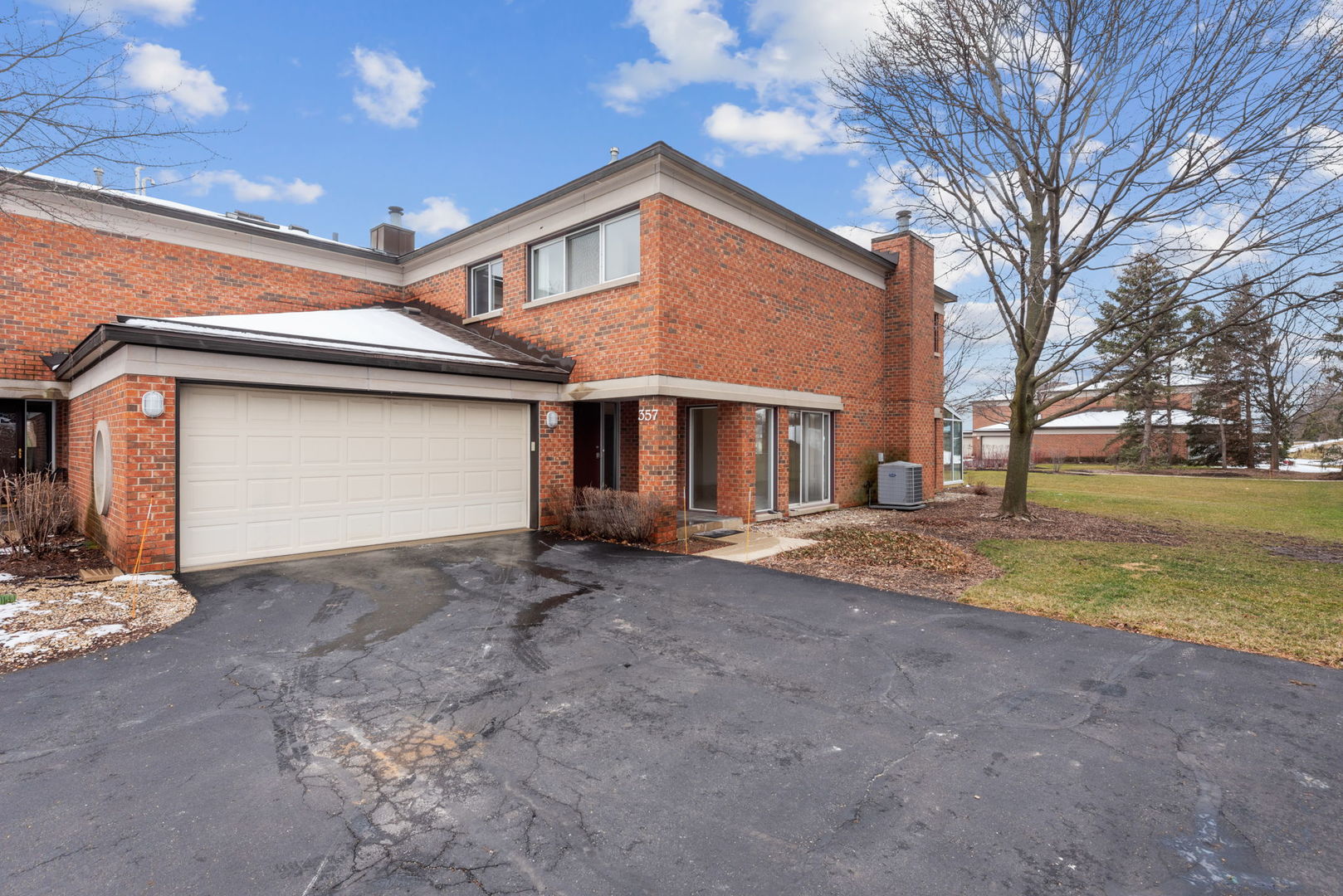 357 Milford Road Deerfield, IL 60015 - Photo 28 of 31 a front view of a house with a yard and garage