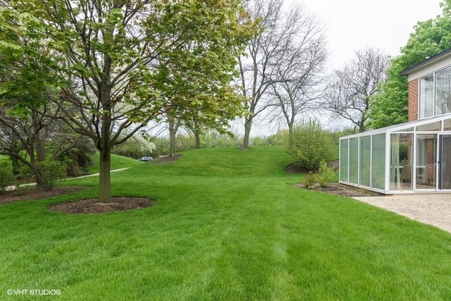 357 Milford Road Deerfield, IL 60015 - Photo 3 of 31 a view of a backyard with large trees
