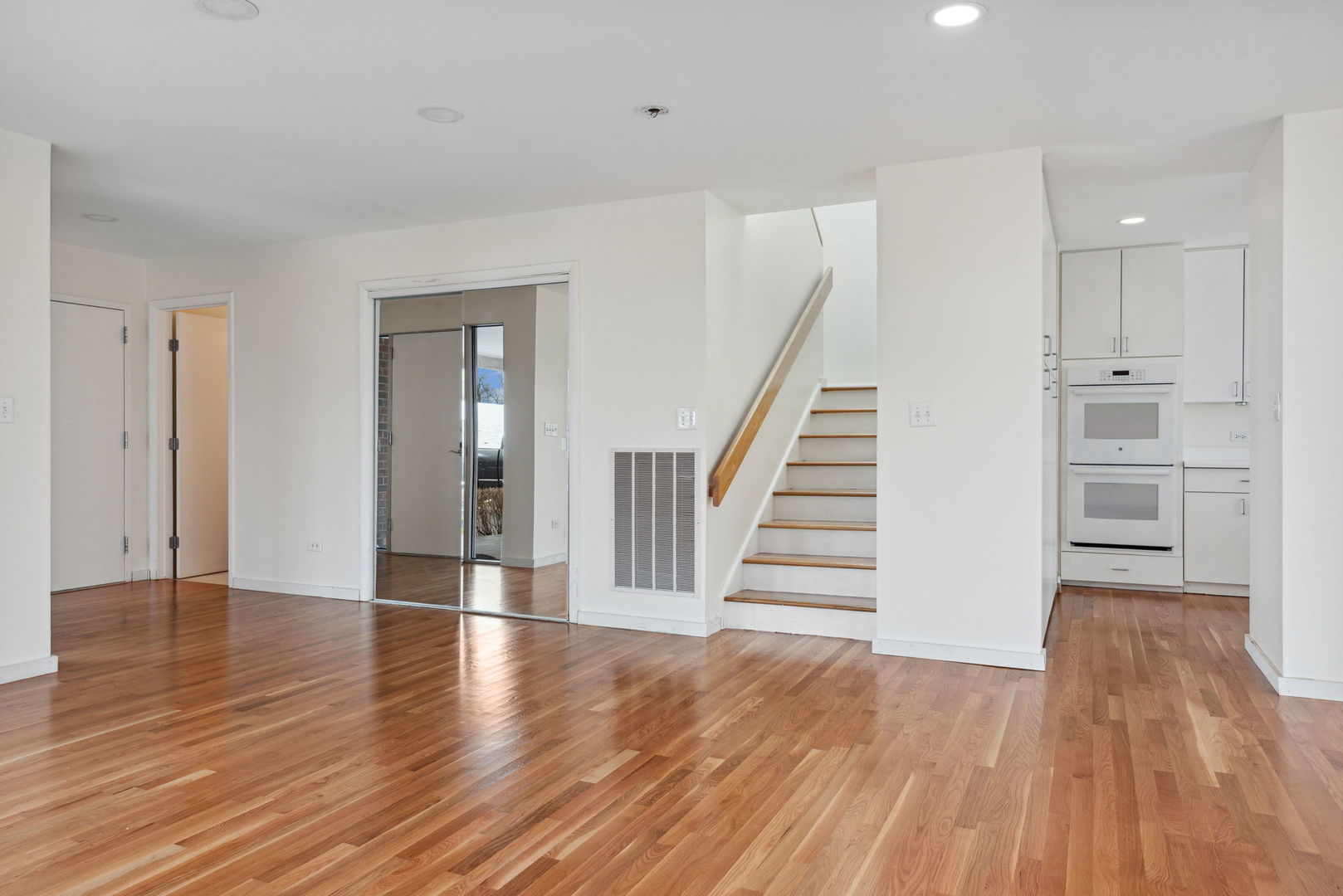 357 Milford Road Deerfield, IL 60015 - Photo 8 of 31 a view of a room with wooden floors and stairs