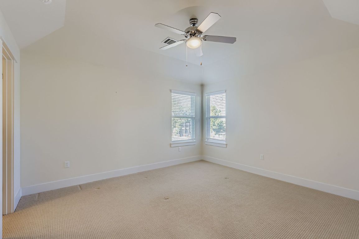 13116 Wingate Way Austin, TX 78727 - Photo 18 of 26 an empty room with a window and a fan