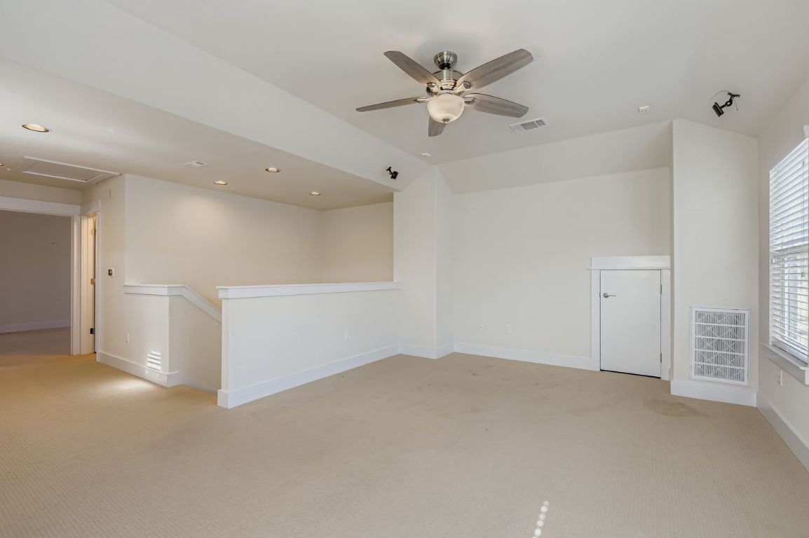 13116 Wingate Way Austin, TX 78727 - Photo 22 of 26 Unfurnished room featuring light colored carpet, ceiling fan, and recessed lighting