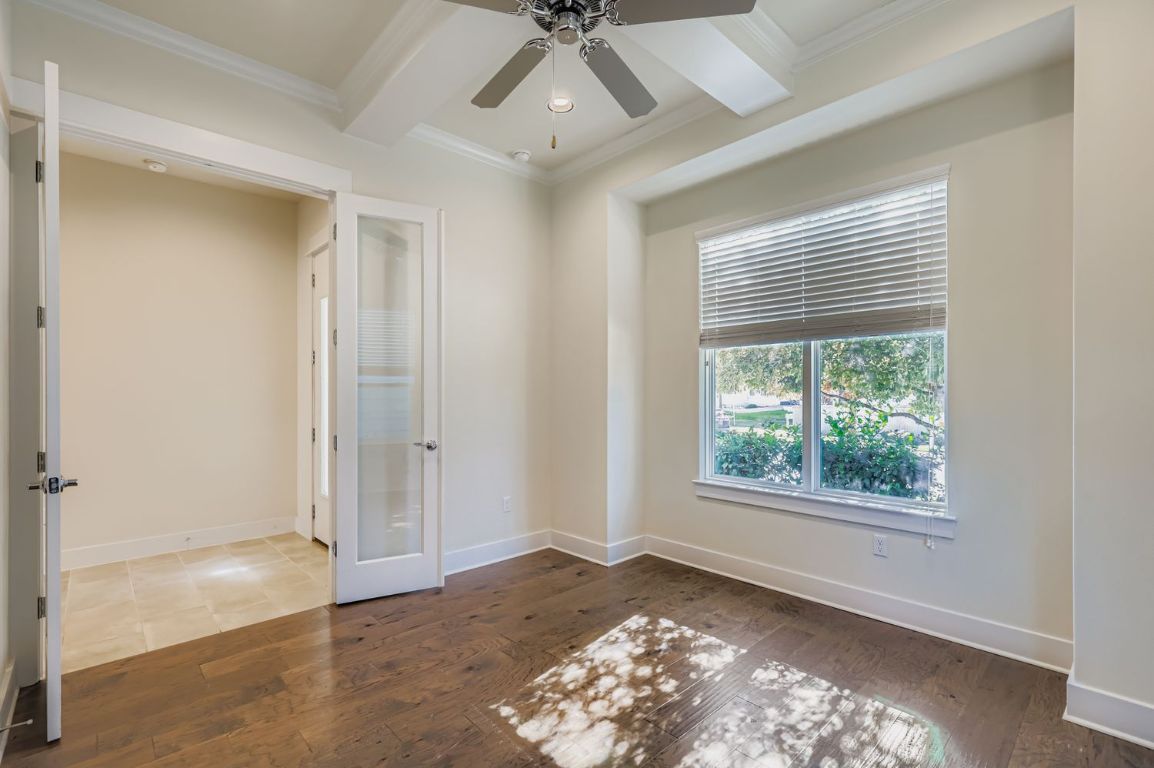 13116 Wingate Way Austin, TX 78727 - Photo 8 of 26 a view of livingroom with window ceiling fan and hardwood floor
