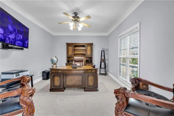 a view of a livingroom with furniture and a window