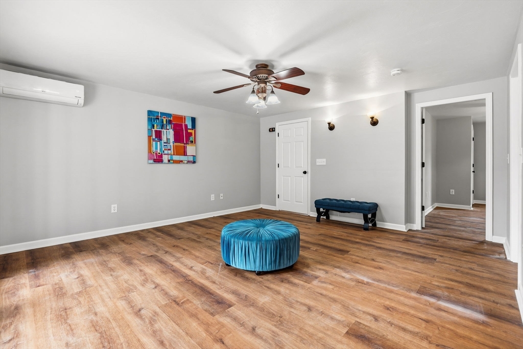 17 Colonial Drive Mendon, MA 01756 - Photo 30 of 42 a living room with furniture and a ceiling fan