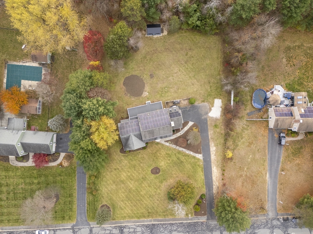 17 Colonial Drive Mendon, MA 01756 - Photo 35 of 42 aerial view of a house with a yard and large trees