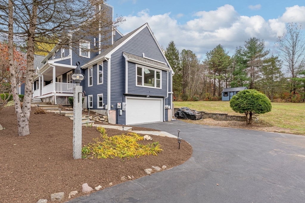 17 Colonial Drive Mendon, MA 01756 - Photo 5 of 42 a view of a house with backyard and sitting area