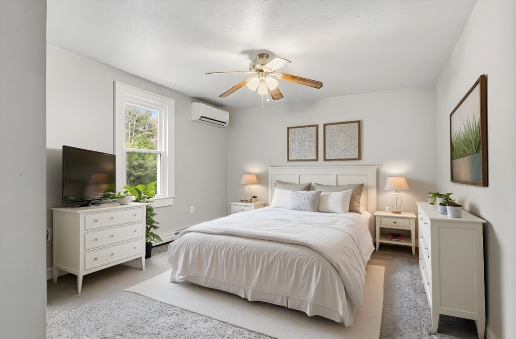 17 Colonial Drive Mendon, MA 01756 - Photo 8 of 42 a bedroom with a bed and a flat screen tv