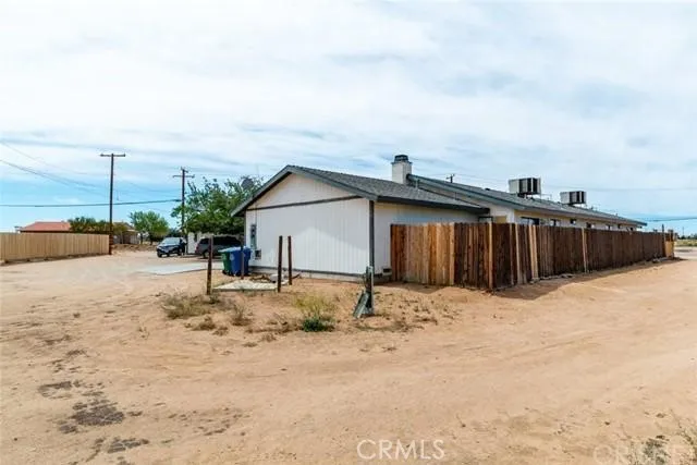 a view of a house with snow on the road