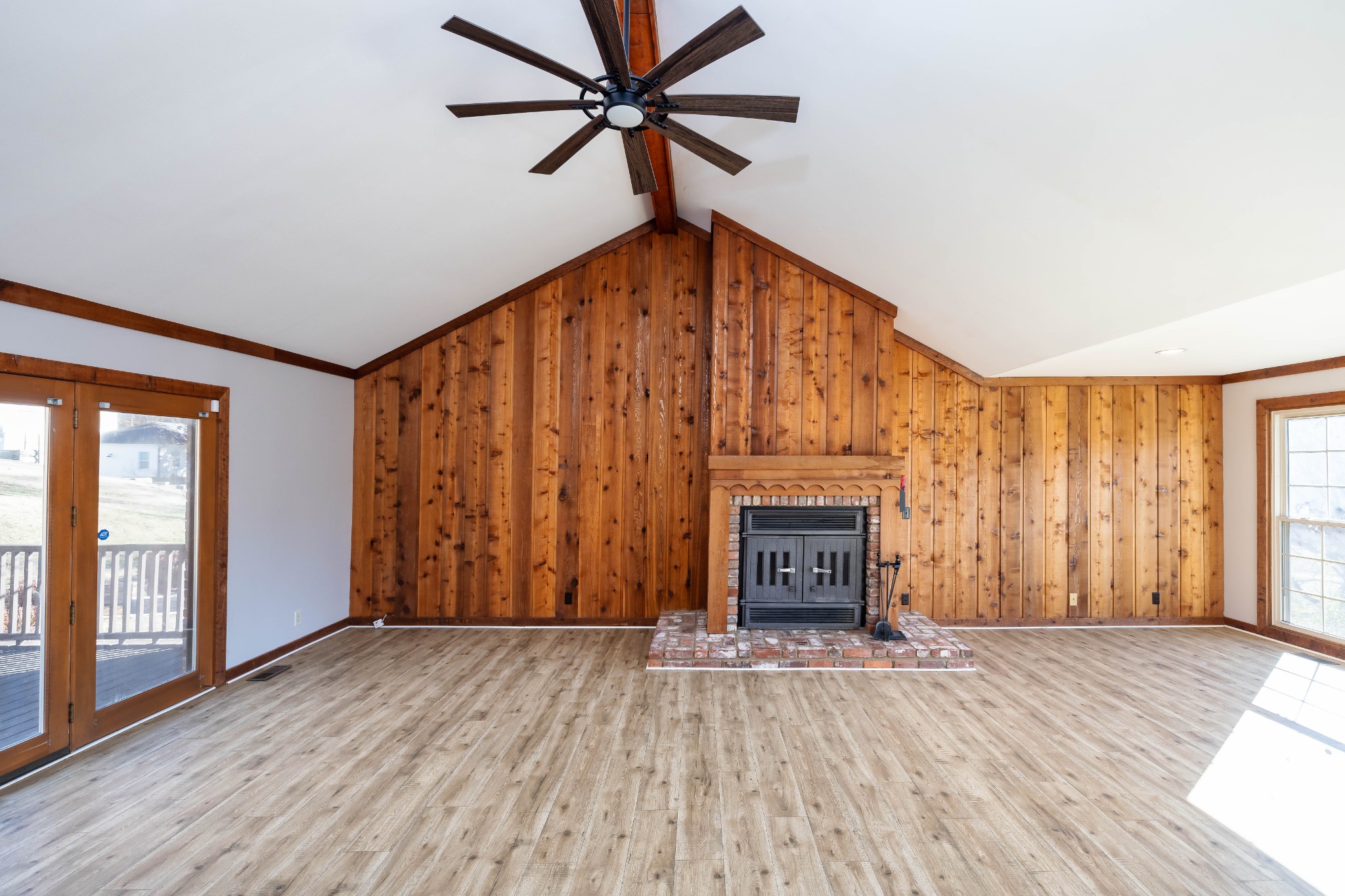 1002 Holly Tree Gap Road Brentwood, TN 37027 - Photo 12 of 27 wooden floor fireplace and windows in an empty room