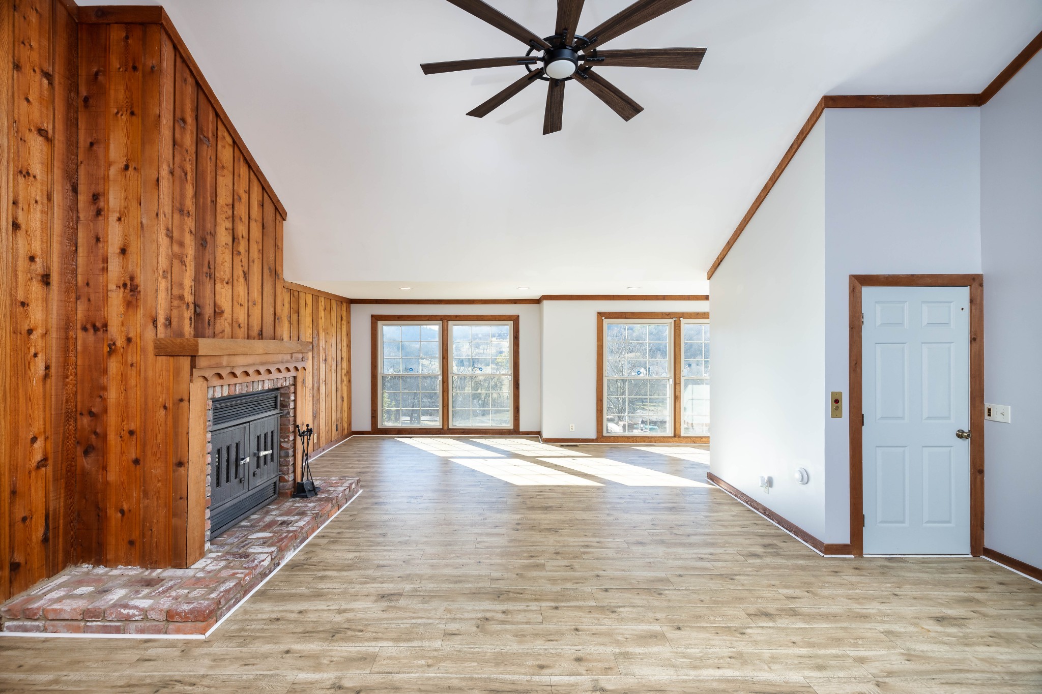 1002 Holly Tree Gap Road Brentwood, TN 37027 - Photo 13 of 27 a view of an empty room with a fireplace and a window
