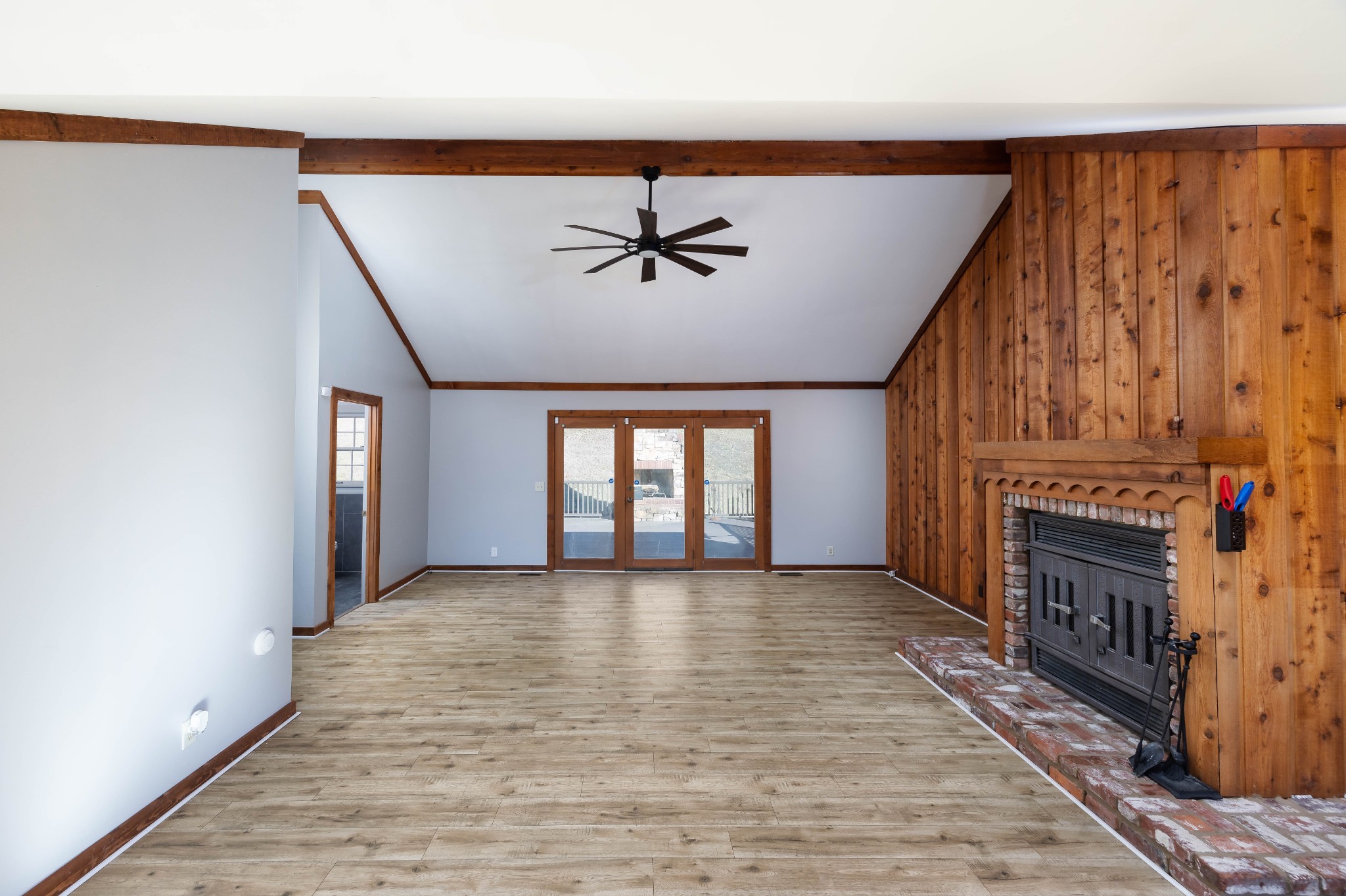 1002 Holly Tree Gap Road Brentwood, TN 37027 - Photo 14 of 27 wooden floor in an empty room with a fireplace