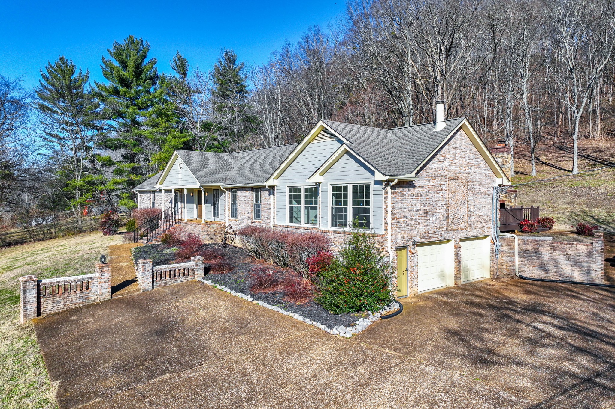 1002 Holly Tree Gap Road Brentwood, TN 37027 - Photo 22 of 27 a front view of a house with a yard and garage