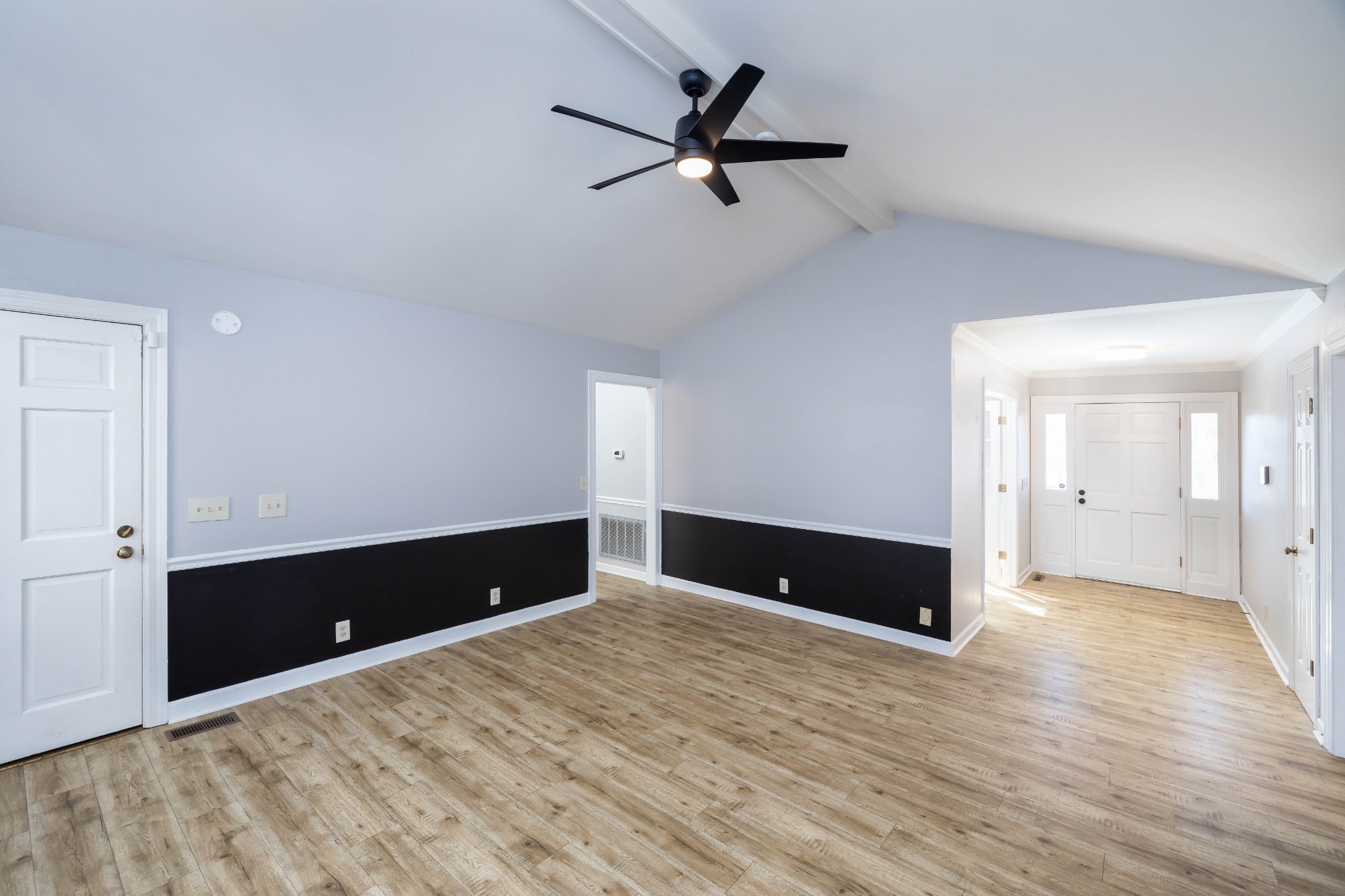 1002 Holly Tree Gap Road Brentwood, TN 37027 - Photo 7 of 27 a view of an empty room and wooden floor