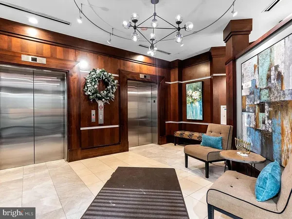 a lobby with furniture and window
