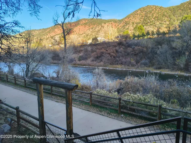 a view of a lake from a balcony