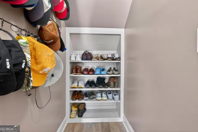 a view of walk in closet with clothes