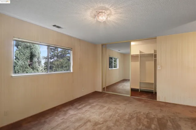 a bathroom with a sink mirror and a shower