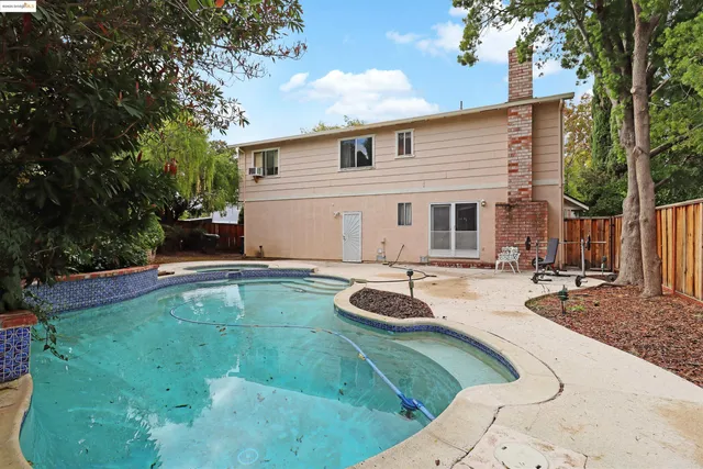 a view of a swimming pool with a yard